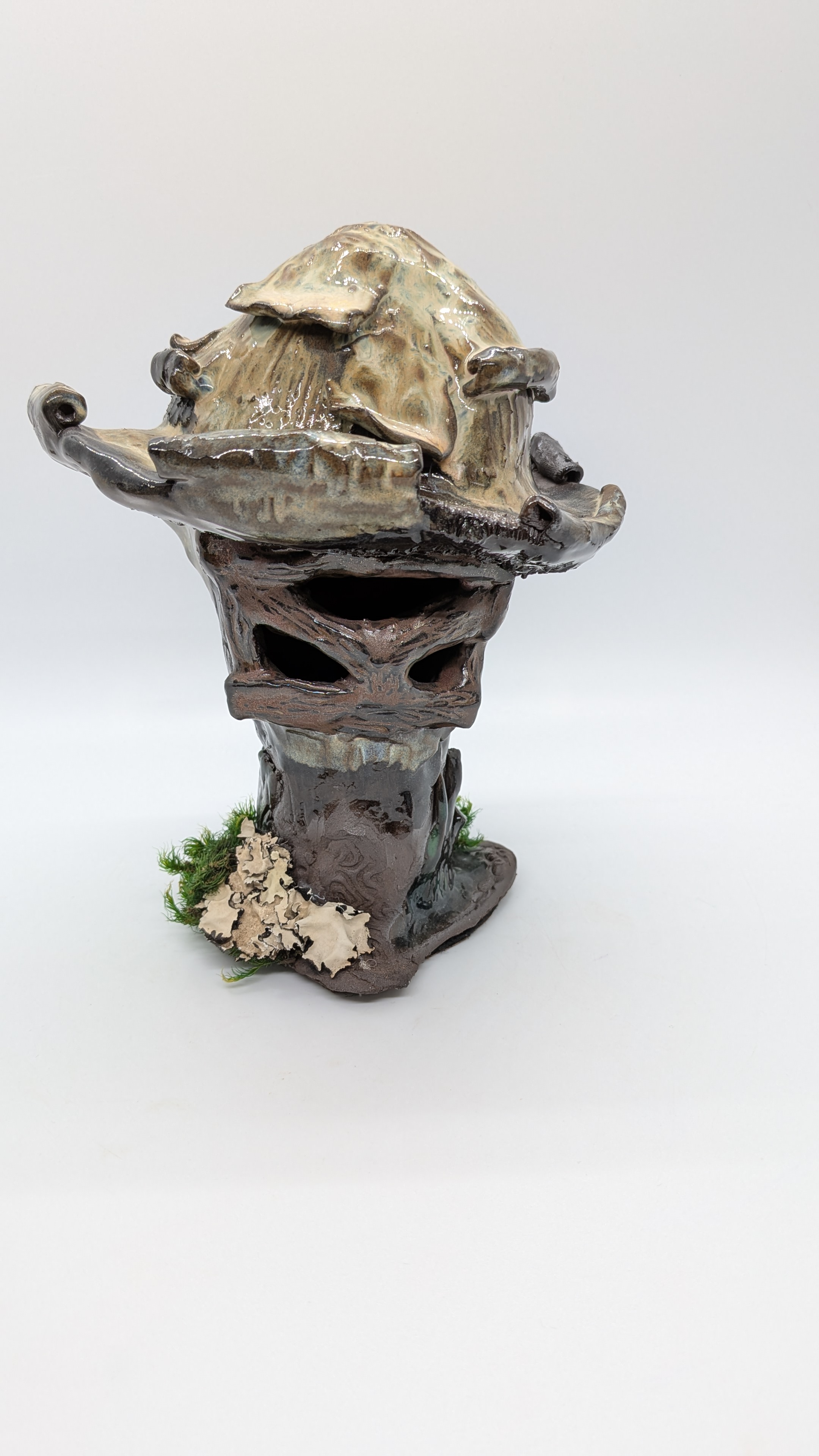 Mushroom Luminaria - This is a hand-built "mushroom house" for plant and mushroom lovers. An opening in the bottom allows you to fit an electric tealight or narrow pillar inside for illumination. It's a cozy little addition to any nature-themed decor. Stands approximately 7" high. - 45.00